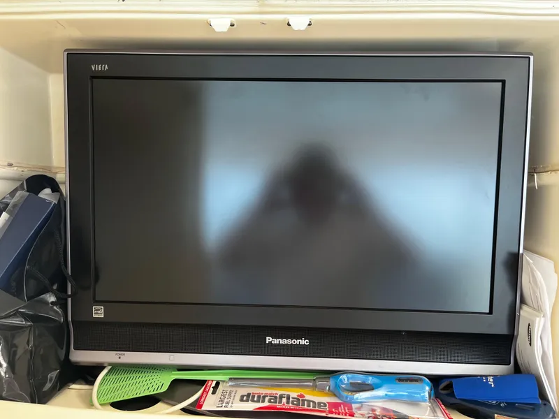 Slide: The Image of Panasonic Viera TV on Hatteras 52 Cockpit Motoryacht, surrounded by various items. - 22