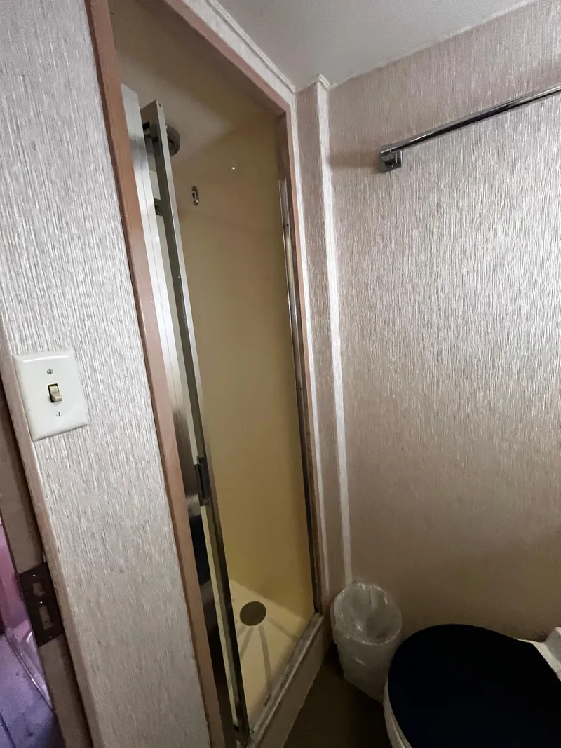 Slide: The Image of Bathroom interior of 1991 Hatteras 52 Cockpit Motoryacht with shower and toilet. - 35