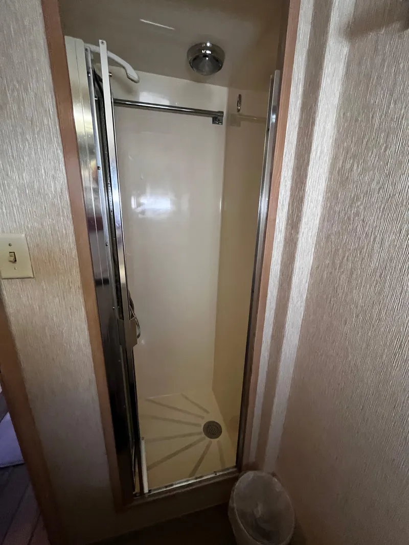 Slide: The Image of Shower stall in 1991 Hatteras 52 Cockpit Motoryacht, featuring a compact design. - 36