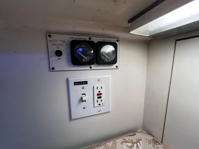 Slide: The Image of Water tank gauges and galley switch on 1991 Hatteras 52 Cockpit Motoryacht. - 44