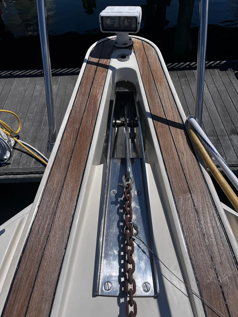 Slide: The Image of Bow of 1991 Hatteras 52 Cockpit Motoryacht with anchor chain and wooden deck. - 5