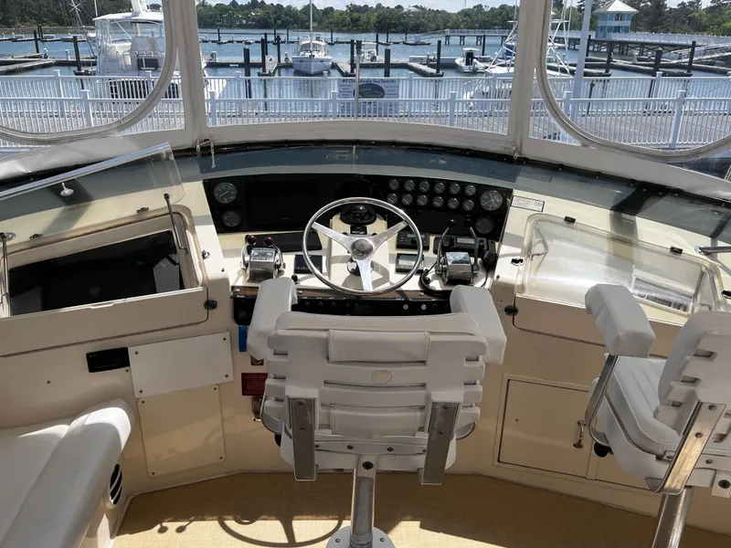 Slide: The Image of Cockpit of 1991 Hatteras 52 Cockpit Motoryacht with steering wheel and control panel. - 8