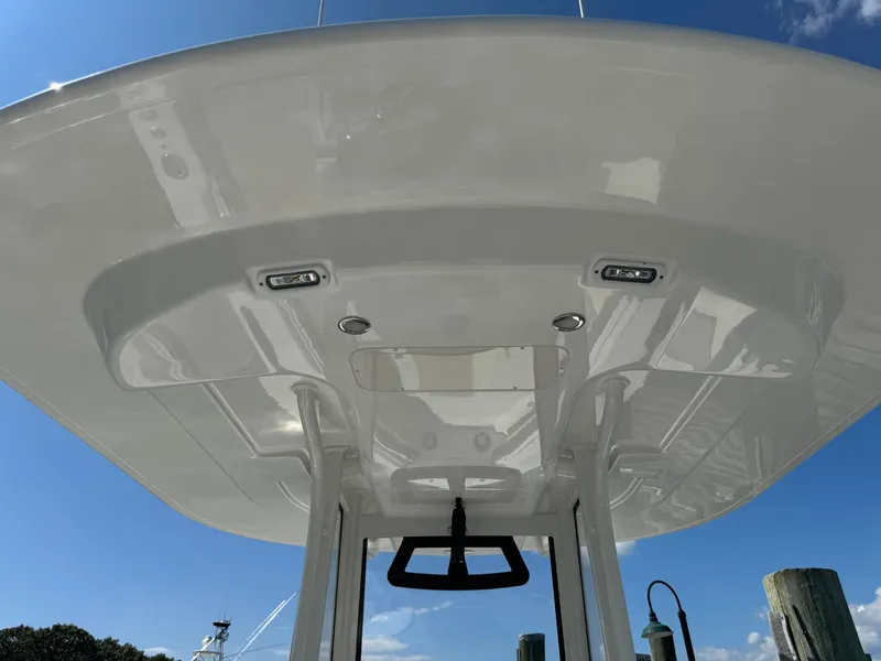 Slide: The Image of 2024 Regulator 23 boat T-top with integrated lights, viewed from below. - 27