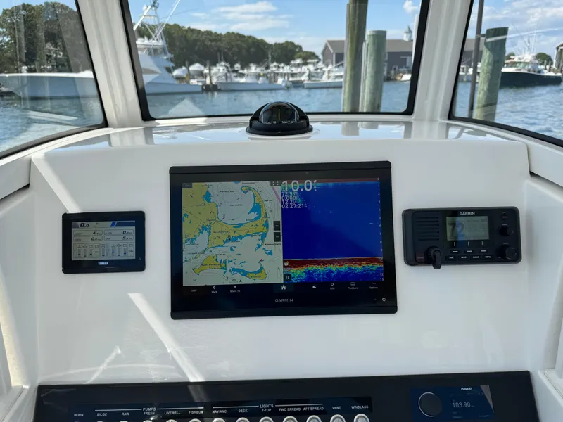 Slide: The Image of 2024 Regulator 23 boat dashboard with navigation and communication systems. - 30