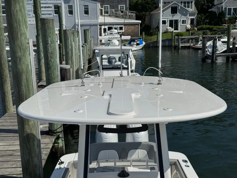 Slide: The Image of 2024 Regulator 23 boat docked at marina, showcasing sleek design and modern features. - 48