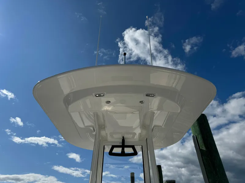 Slide: The Image of 2024 Regulator 23 boat against a clear blue sky. - 19