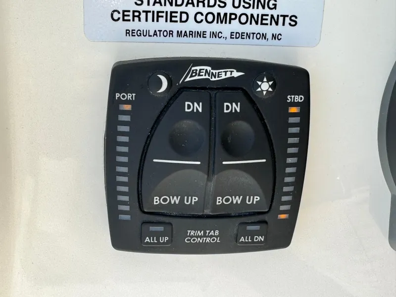 Slide: The Image of Bennett trim tab control panel on 2024 Regulator 23 boat. - 29