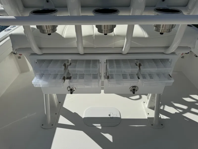 Slide: The Image of 2024 Regulator 23 boat with organized tackle storage compartments. - 19