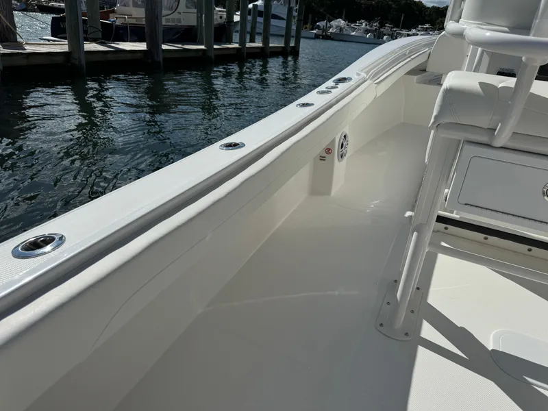 Slide: The Image of 2024 Regulator 23 boat interior, sleek design, docked by the water. - 22