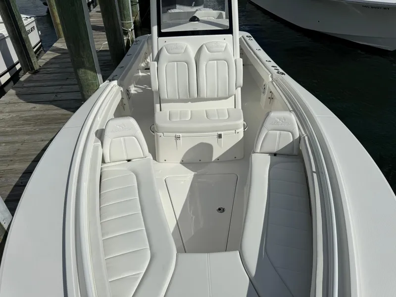 Slide: The Image of 2024 Regulator 23 boat interior with white seating and console. - 44