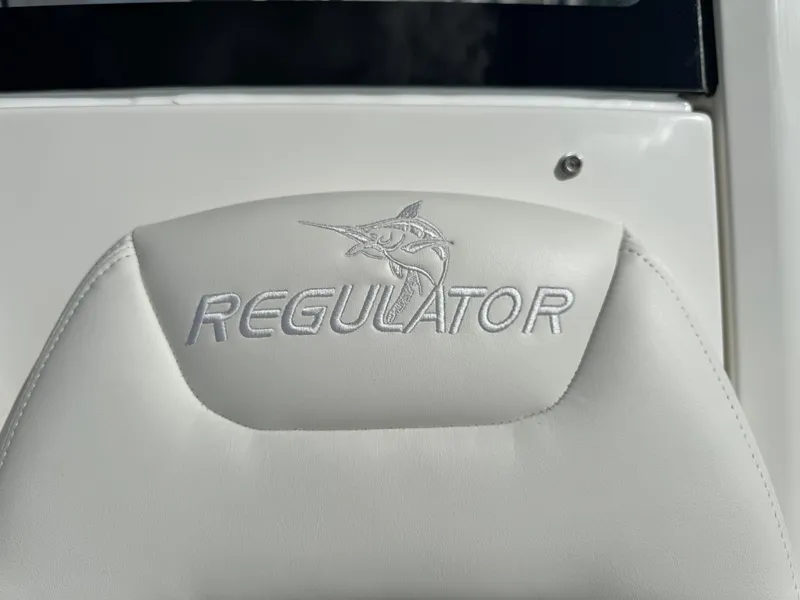 Slide: The Image of 2024 Regulator 23 boat seat with embroidered logo and marlin design. - 47