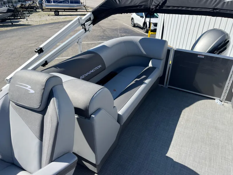 Slide: The Image of 2024 Bennington 22 SVSR pontoon boat interior with gray seating and spacious layout. - 13