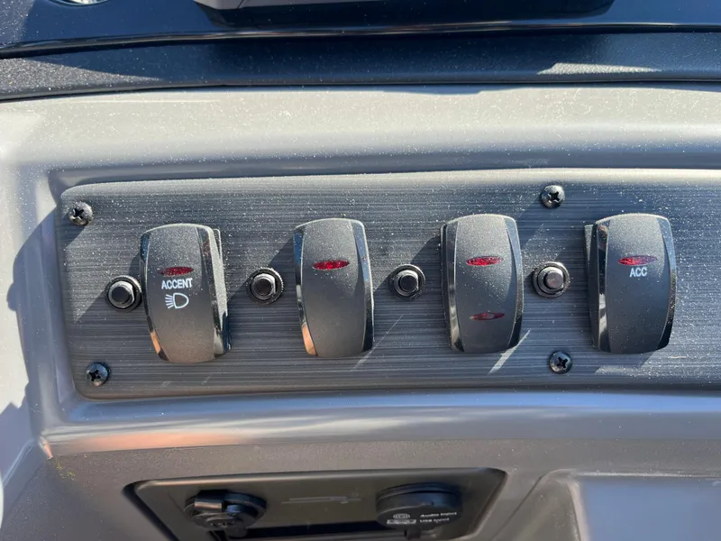 Slide: The Image of Control panel of 2024 Bennington 22 SVSR boat with switches and buttons. - 20