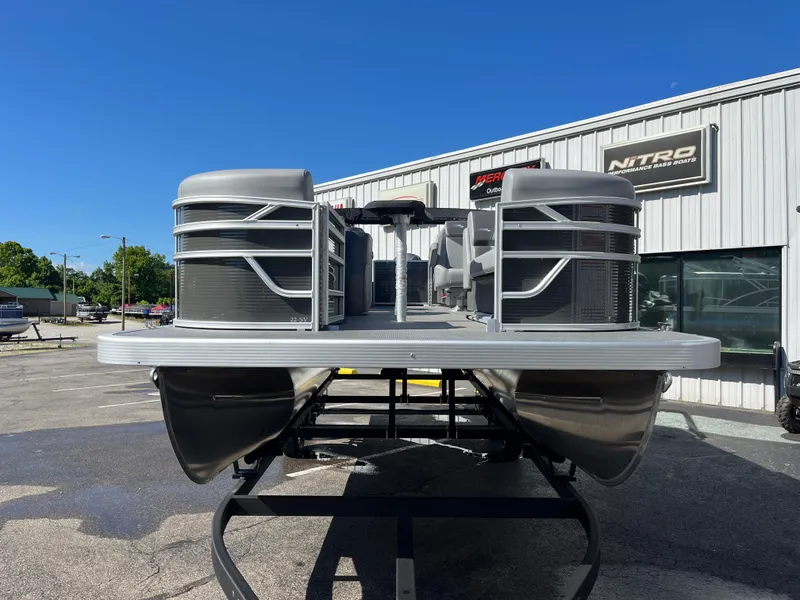 Slide: The Image of 2024 Bennington 22 SVSR pontoon boat on display at a dealership. - 3