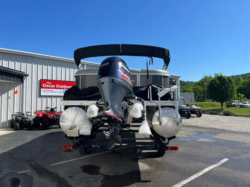 Slide: The Image of 2024 Bennington 22 SVSR pontoon boat at dealership, rear view. - 7