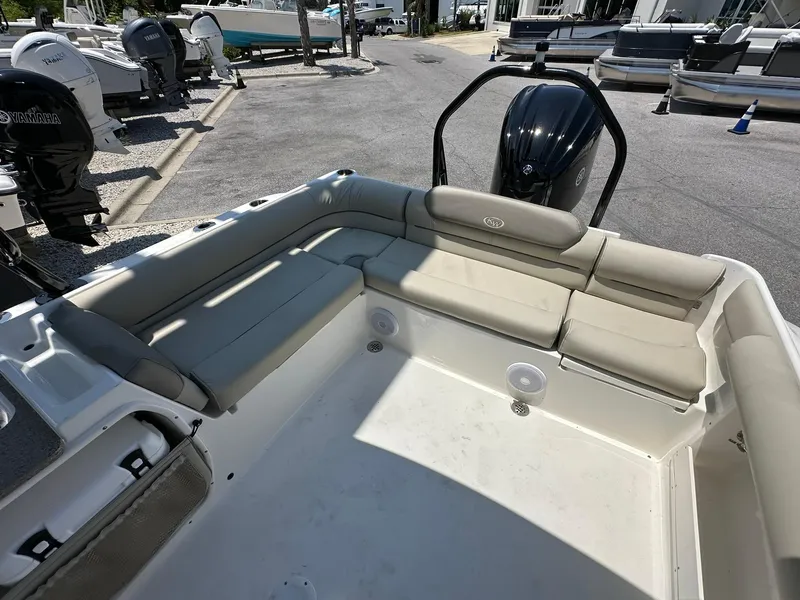 Slide: The Image of 2024 Key West 239 DFS boat interior with seating and outboard motor. - 11