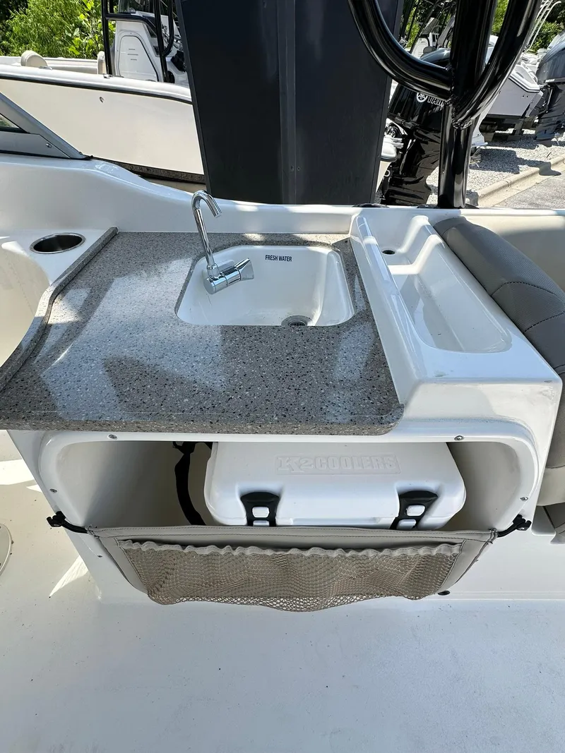 Slide: The Image of 2024 Key West 239 DFS boat with sink and storage compartment. - 12