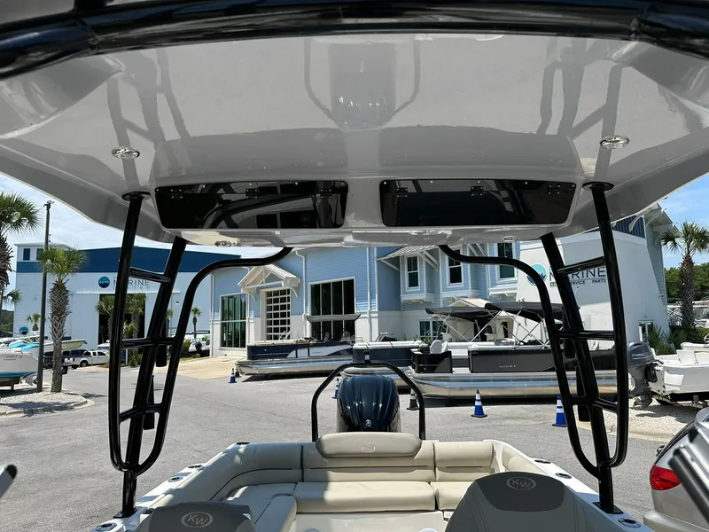 Slide: The Image of 2024 Key West 239 DFS boat interior with seating and canopy. - 13