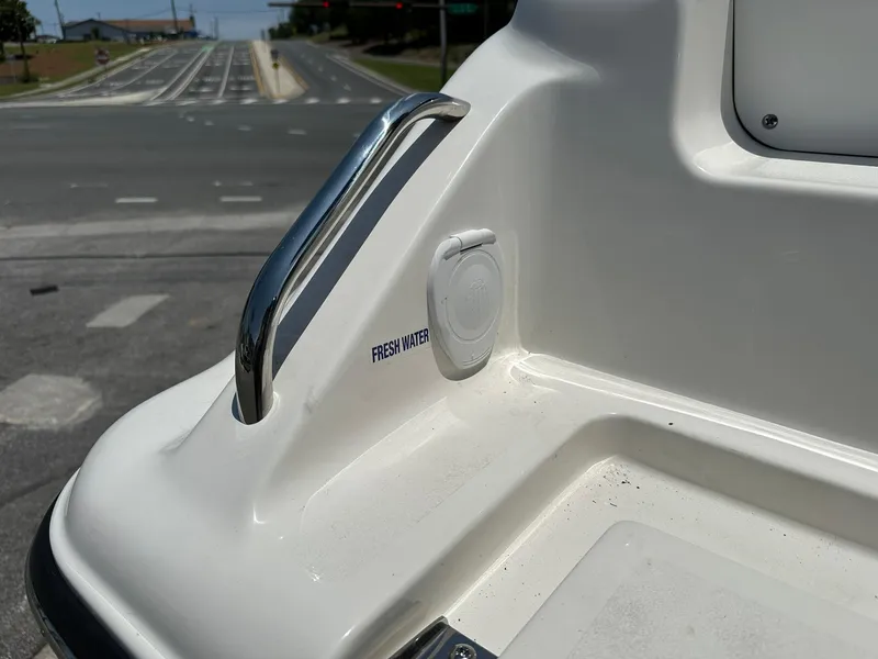 Slide: The Image of 2024 Key West 239 DFS boat with fresh water outlet and handrail. - 5