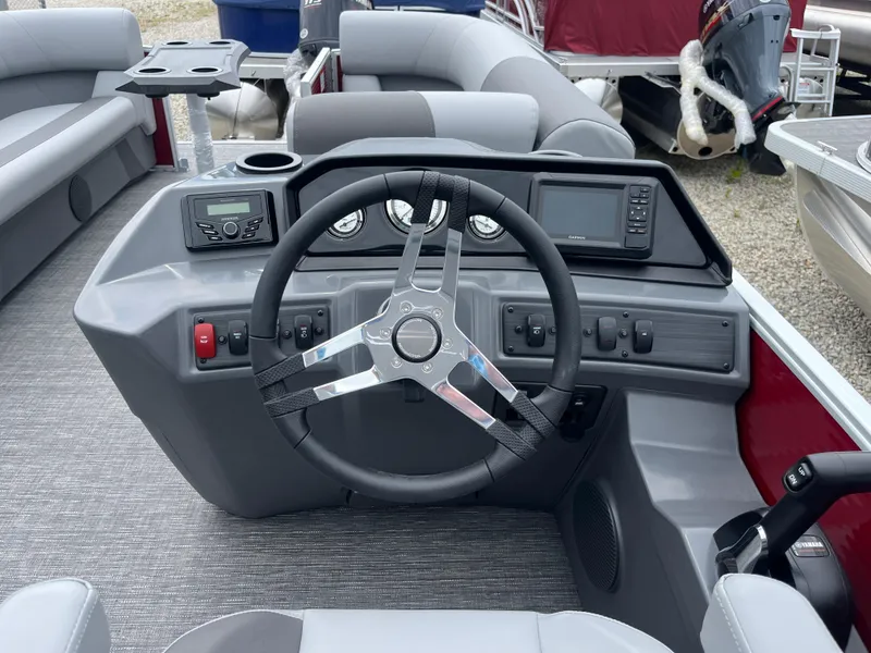 Slide: The Image of 2024 Bennington 22 SVSR boat dashboard with steering wheel and control panel. - 11