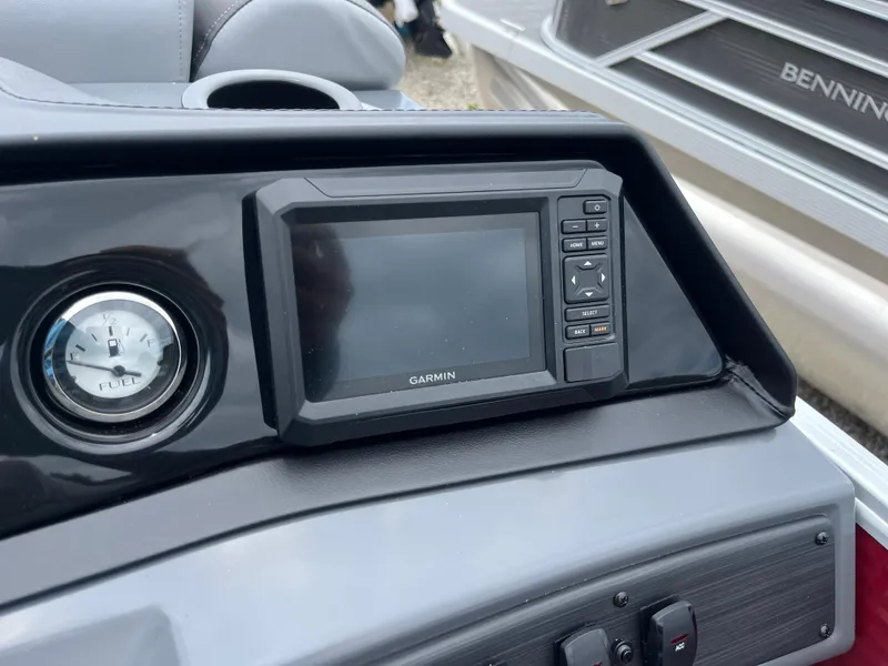 Slide: The Image of Garmin display and fuel gauge on 2024 Bennington 22 SVSR boat dashboard. - 12