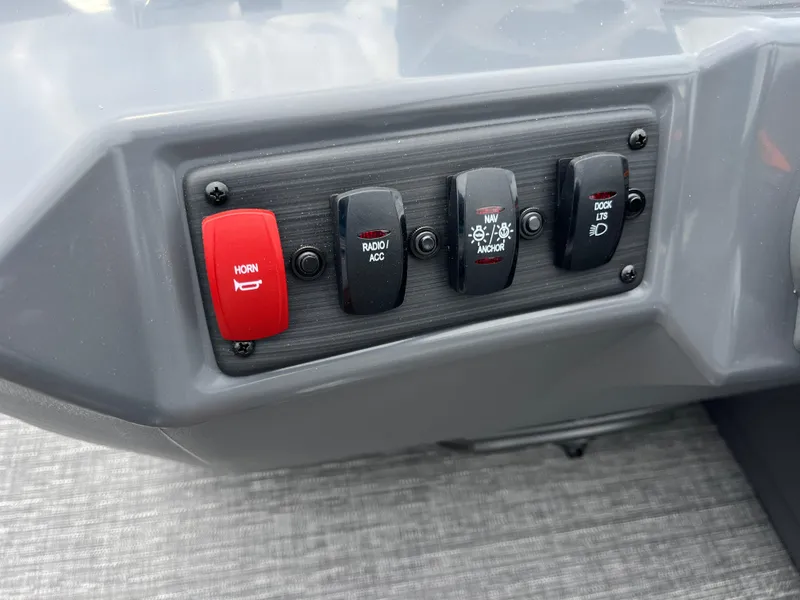 Slide: The Image of Control panel of a 2024 Bennington 22 SVSR boat with horn and accessory switches. - 15