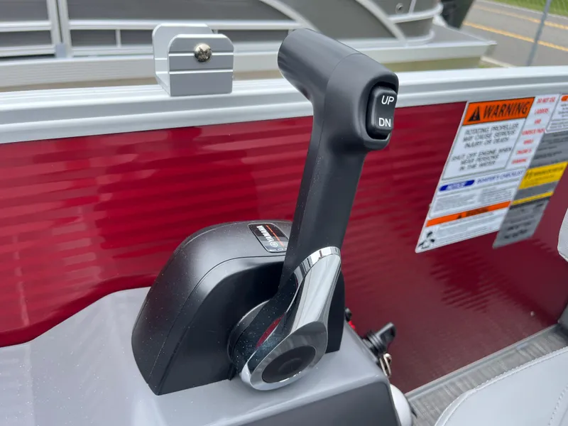 Slide: The Image of 2024 Bennington 22 SVSR throttle control lever with warning labels. - 17