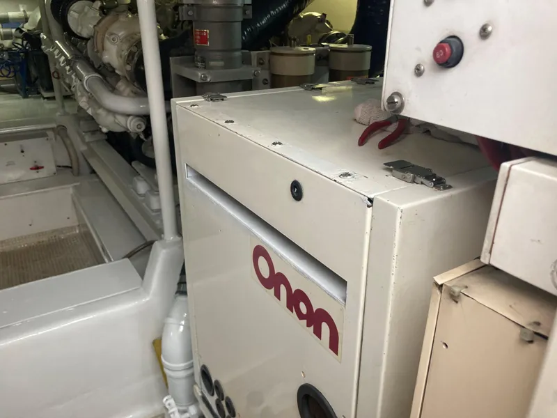 Slide: The Image of Engine room of 1999 Viking 55 Sport Fish with Onan generator visible. - 33