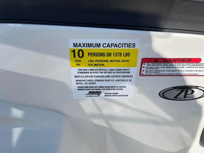 Slide: The Image of 2024 Stingray 201 DC boat capacity label, max 10 persons or 1378 lbs. - 12