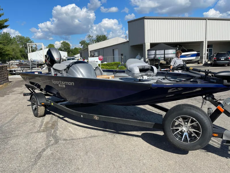 Slide: The Image of 2024 G3 Sportsman 1710 PFX fishing boat on trailer in outdoor lot. - 12