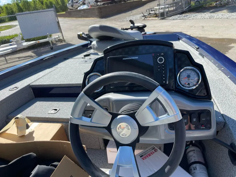 Slide: The Image of 2024 G3 Sportsman 1710 PFX boat dashboard with steering wheel and navigation system. - 15