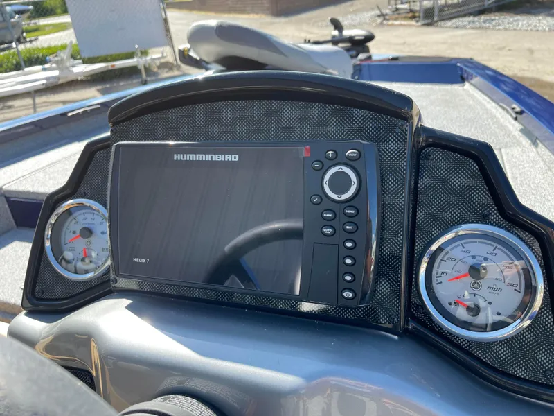 Slide: The Image of 2024 G3 Sportsman 1710 PFX dashboard with Humminbird fish finder and gauges. - 5
