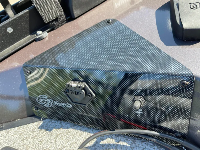 Slide: The Image of 2024 G3 Sportsman 1710 PFX boat control panel with carbon fiber finish. - 15
