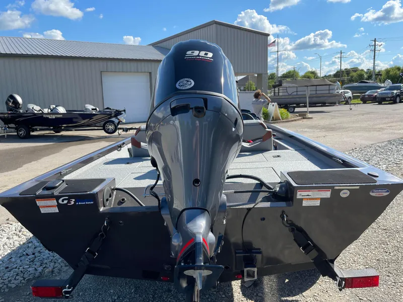 Slide: The Image of 2024 G3 Sportsman 1710 PFX boat with 90 HP outboard motor, rear view. - 6