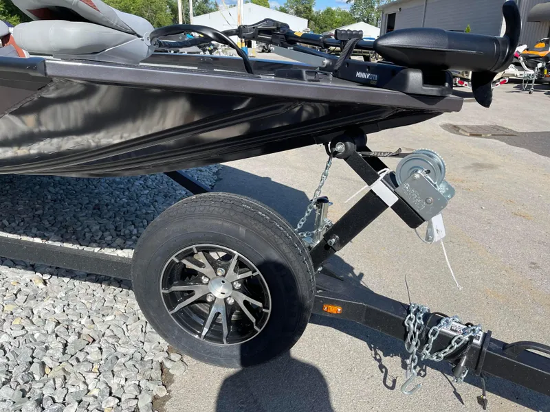 Slide: The Image of 2024 G3 Sportsman 1710 PFX boat trailer with black wheel and winch. - 9