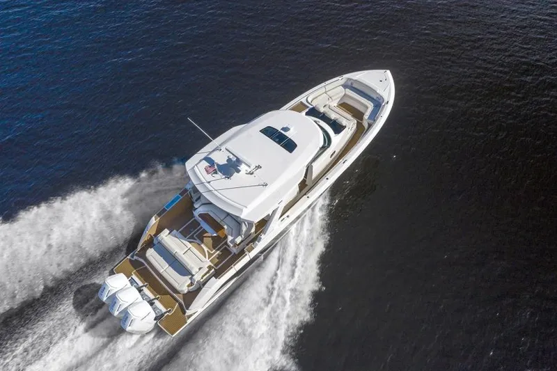 Slide: The Image of 2023 Tiara Yachts 48 LS cruising on open water. - 13