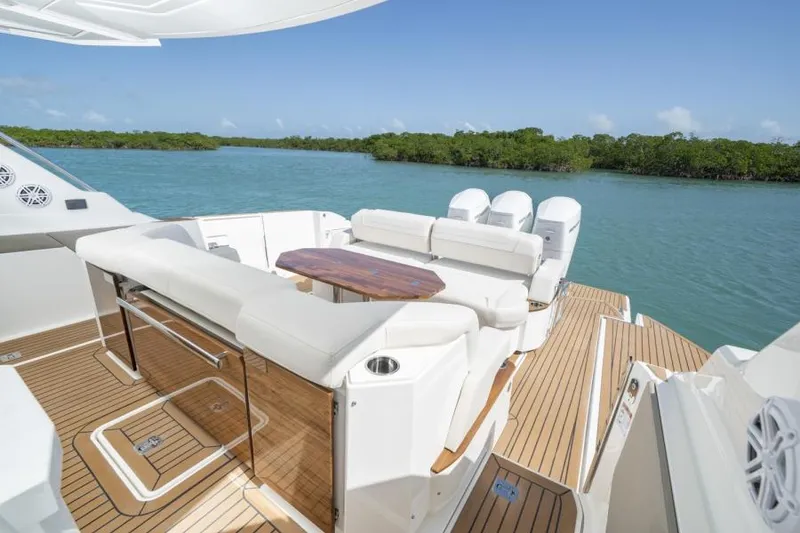 Slide: The Image of 2023 Tiara Yachts 48 LS luxury boat with spacious seating and scenic water view. - 19