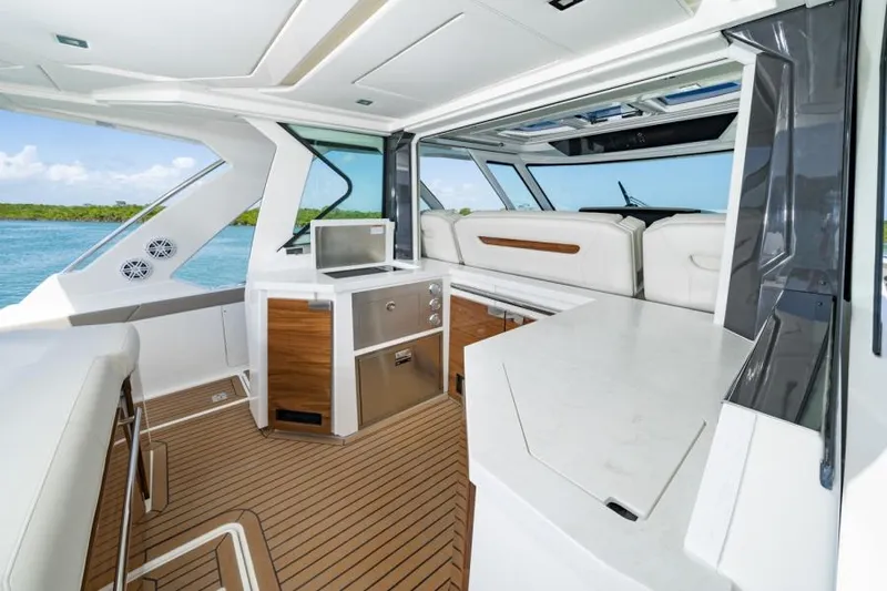 Slide: The Image of 2023 Tiara Yachts 48 LS interior with modern kitchen and seating area. - 23