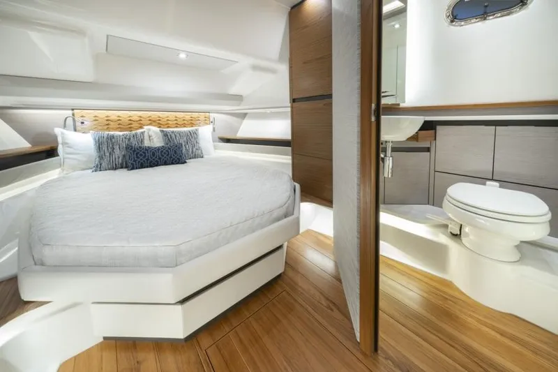 Slide: The Image of 2023 Tiara Yachts 48 LS interior cabin with bed and bathroom. - 32