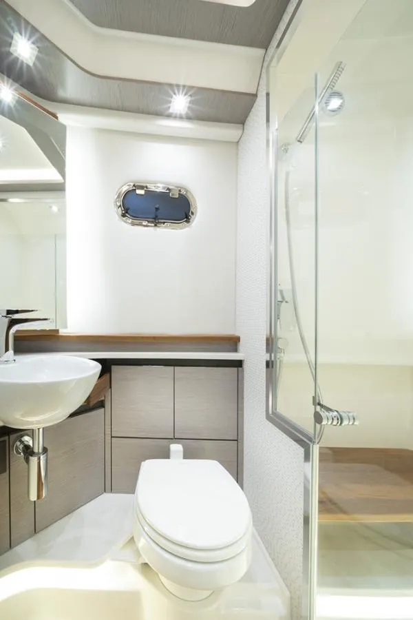 Slide: The Image of 2023 Tiara Yachts 48 LS bathroom with modern fixtures and sleek design. - 35