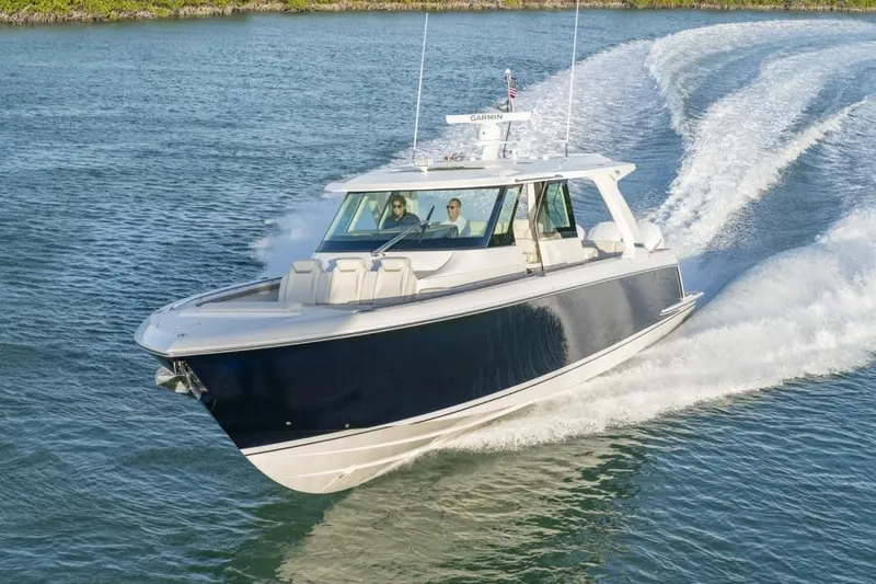 Slide: The Image of 2023 Tiara Yachts 48 LS cruising on open water. - 6