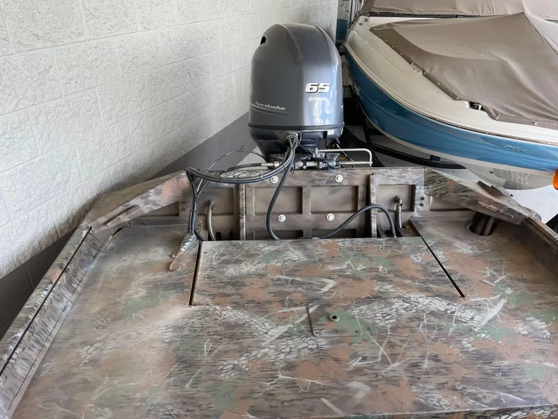 Slide: The Image of 2024 G3 Gator Tough 17 CCJ boat with 65 HP outboard motor. - 12