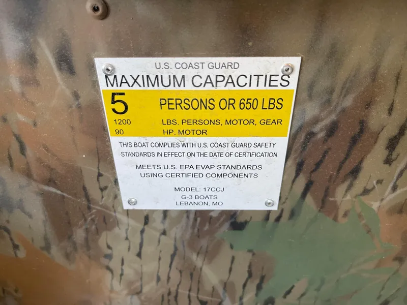 Slide: The Image of 2024 G3 Gator Tough 17 CCJ boat capacity label, max 5 persons or 650 lbs. - 5