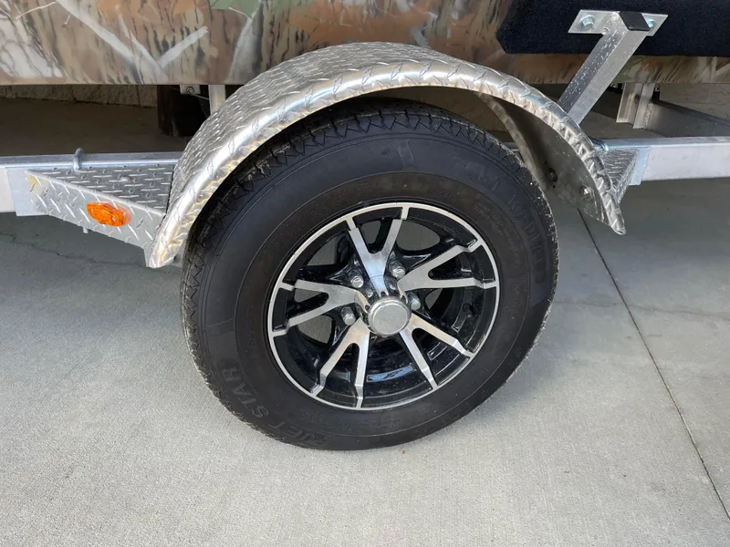Slide: The Image of 2024 G3 Gator Tough 17 CCJ trailer wheel with black and silver rim. - 9