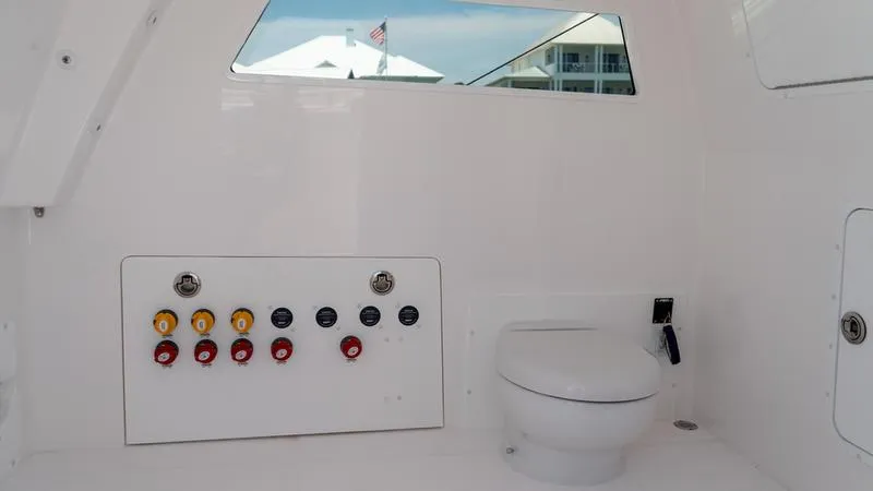 Slide: The Image of 2024 Invincible 40' Catamaran interior with control panel and toilet. - 15