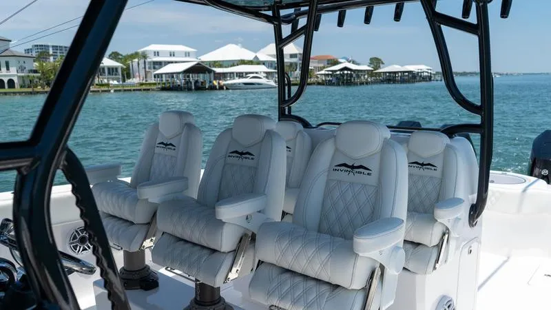 Slide: The Image of 2024 Invincible 40' Catamaran with luxurious seating on the water. - 21