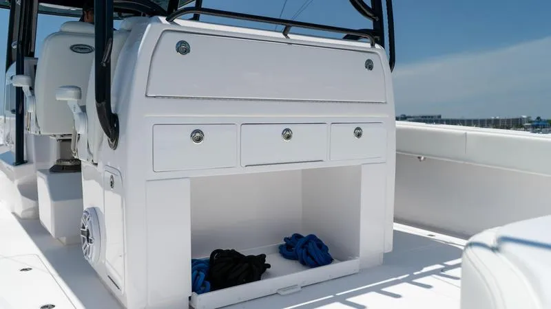 Slide: The Image of 2024 Invincible 40' Catamaran storage compartment with drawers and open space. - 27