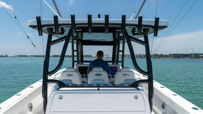 Slide: The Image of 2024 Invincible 40' Catamaran on water, rear view of helm station. - 28