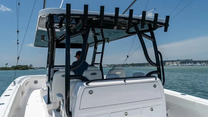 Slide: The Image of 2024 Invincible 40' Catamaran on the water, rear view of cockpit and seating. - 29