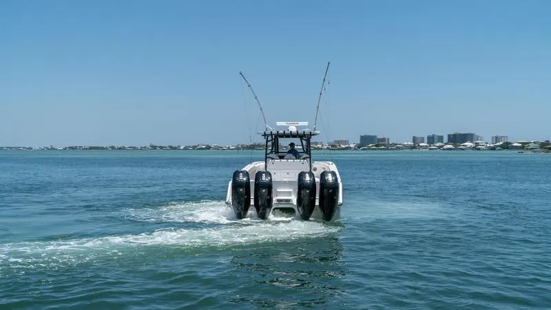 Slide: The Image of 2024 Invincible 40' Catamaran cruising on open water. - 6